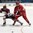 SPISSKA NOVA VES, SLOVAKIA - APRIL 21: Latvia's Deniss Smirnovs #10 and Vladislav Yeryomenko #8 of Belarus battle for the loose puck during relegation round action at the 2017 IIHF Ice Hockey U18 World Championship. (Photo by Andrea Cardin/HHOF-IIHF Images)

